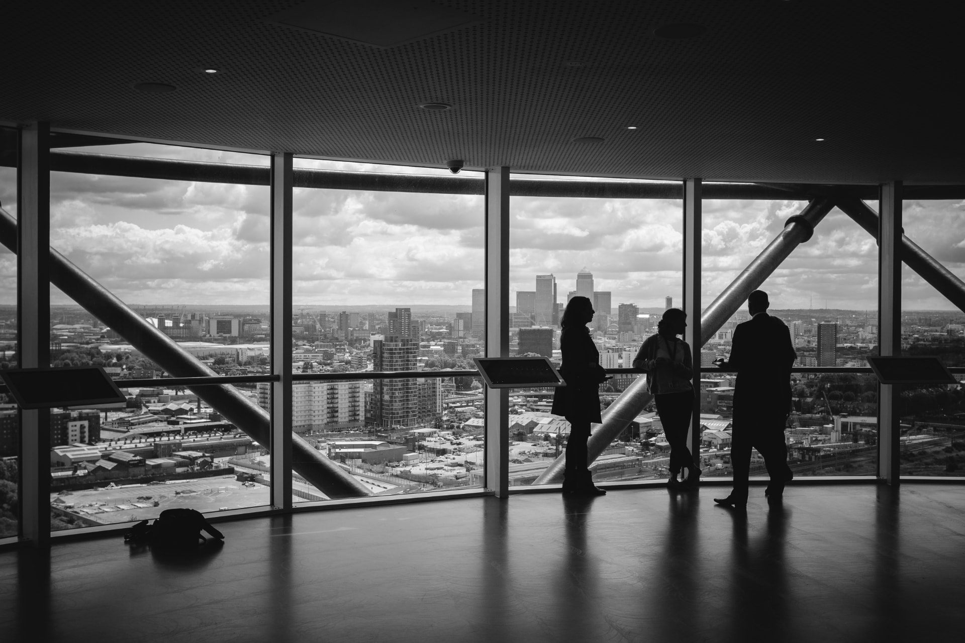 Professionals overlooking the London skyline